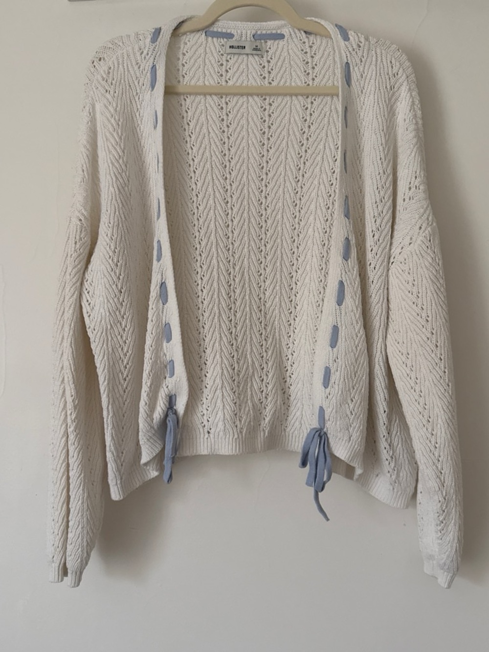 Hollister Cream Open-Front Knit Cardigan with Blue Ribbon Detail
